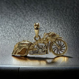 14k YG motorcycle pendant with a diamond breather