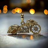14k YG motorcycle pendant with a diamond breather